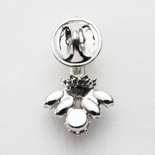 画像をギャラリービューアに読み込む, ヒイラギの上に置かれたろうそくをイメージしたビジューバッジ