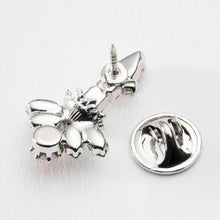 画像をギャラリービューアに読み込む, ヒイラギの上に置かれたろうそくをイメージしたビジューバッジ