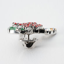 画像をギャラリービューアに読み込む, ヒイラギの上に置かれたろうそくをイメージしたビジューバッジ