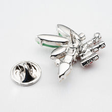 画像をギャラリービューアに読み込む, ヒイラギの上に置かれたろうそくをイメージしたビジューバッジ