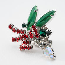 画像をギャラリービューアに読み込む, ヒイラギの上に置かれたろうそくをイメージしたビジューバッジ